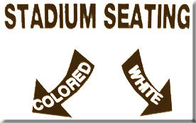 photo of a sign with the words Stadium Seating and arrows pointing to Colored and White sections